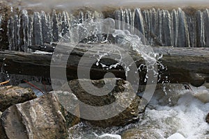 A perfect shot of water cascading over a small waterfall