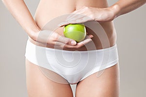 Perfect Slim Woman Body and apple. Diet Concept