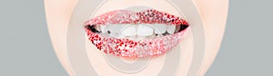 Perfect smile with red lips and white healthy teeth. Female mouth with glitter lipstick makeup