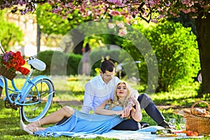 Perfect spring date. Idyllic moment in garden. Man and woman in love. Picnic time. Long lasting relationship. Couple