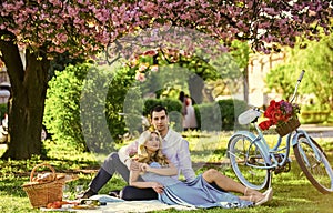 Perfect spring date. Man and woman in love. Picnic time. Long lasting relationship. Couple having picnic in local park