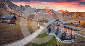 Perfect sunrise on Fuchiade valley with old country road, Italy, Europe.