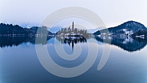 Perfect symetry of a lake and church on small island photo