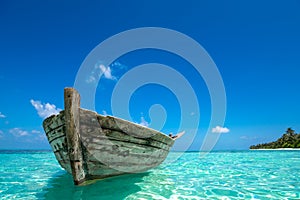 Perfect tropical island paradise beach and old boat