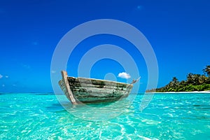 Perfect tropical island paradise beach and old boat