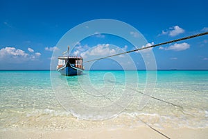 Perfect tropical island paradise beach and old boat