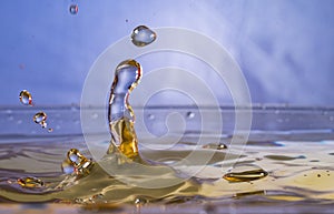 Perfect waterdrop in a light bue light