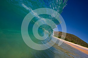 Perfect Wave Breaks on Beach