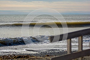 Perfect wave on a sunny day with foreground background bohkeh