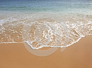 The perfect wave touches the perfect sand