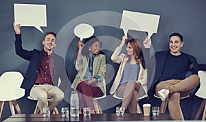 The perfect way to get your message out there. a group of businesspeople holding up speech bubbles while waiting in line