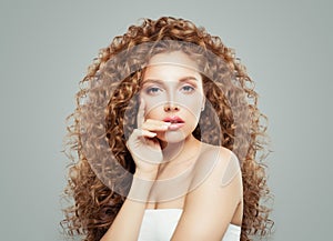 Perfect woman with long healthy curly hair. Redhead girl, haircare concept