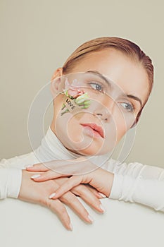 Perfect woman with Love inscription and spring flowers on white background portrait