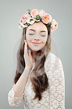 Perfect Woman Model with Curly Hair, Makeup and Flowers. Relaxing Girl, Eyes Closed