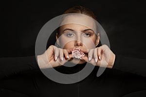 Perfect woman with rose flower on black background