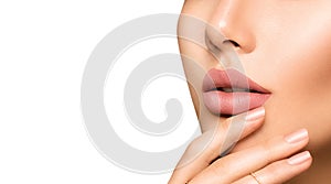 Perfect woman's lips with fashion natural beige matte lipstick photo