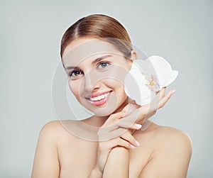 Perfect woman spa model with beautiful skin and white flower
