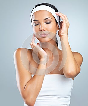 Perfection and beauty. Cropped studio shot of a beautiful young woman wearing a headband.