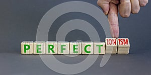 Perfectionism symbol. Concept words Perfect or Perfectionism beautiful wooden blocks. Beautiful grey table grey background.