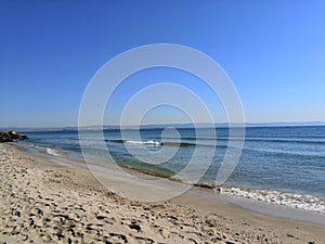 A perfectly flat horizon of the calm sea without waves and clear skies, the background of natural tranquillity. summer trip