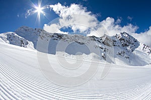 Perfectly groomed empty ski piste