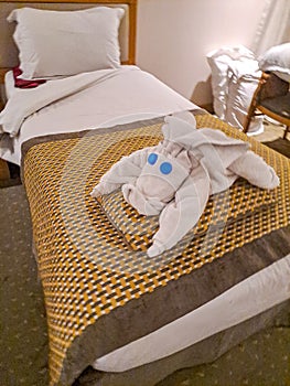 Perfectly prepared hotel bed seen from a hippopotamus from towels. Egypt