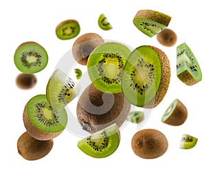 Perfectly retouched kiwis, whole halves and slices fly and levitate in space. Isolated on white