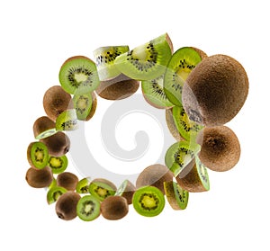 Perfectly retouched kiwis, whole halves and slices fly and levitate in space. Isolated on white