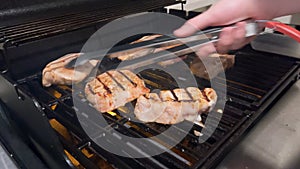 Perfectly Seasoned Pork Chops Sizzling on an Outdoor Gas Grill