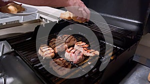 Perfectly Seasoned Pork Chops Sizzling on an Outdoor Gas Grill