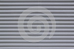 Perforated metal security shutter background photo