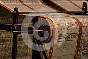 The perforated paper tape of an old device