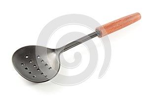 Perforated spoon on white