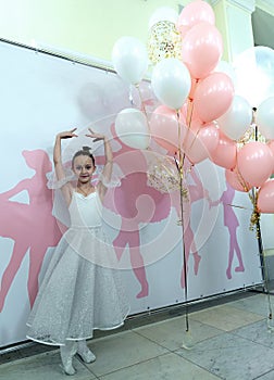Performance of a children`s private ballet school. Portrait of little girl.