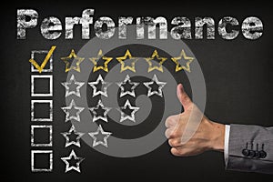 Performance five 5 star rating. thumbs up service golden rating stars on chalkboard