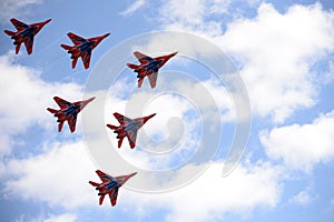 Performance of the Swifts aerobatic team on multi-purpose highly maneuverable MiG-29 fighters over the Myachkovo airfield photo