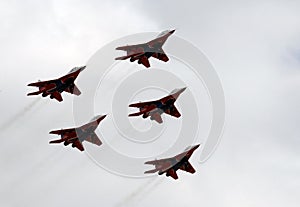 Performance of the Swifts aerobatic team on multi-purpose highly maneuverable MiG-29 fighters over the Myachkovo airfield photo