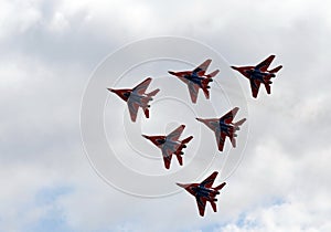 Performance of the Swifts aerobatic team on multi-purpose highly maneuverable MiG-29 fighters over the Myachkovo airfield photo