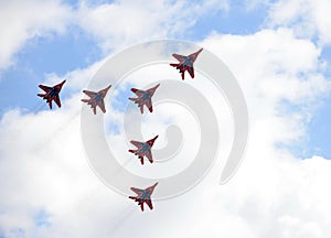 Performance of the Swifts aerobatic team on multi-purpose highly maneuverable MiG-29 fighters over the Myachkovo airfield photo