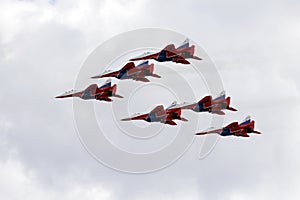 Performance of the Swifts aerobatic team on multi-purpose highly maneuverable MiG-29 fighters over the Myachkovo airfield photo