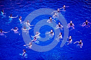 Performance of synchronized swimming dance