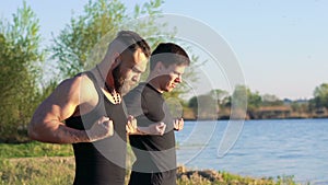 The performance of Wing Chun between strong men near river. Slowly