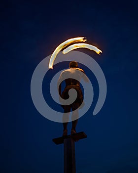 Performer dancing with fire on the beach in Koh Lipe, Thailand