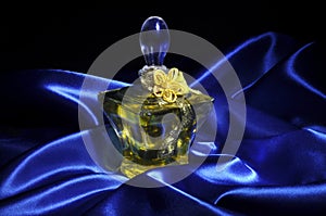 Perfume on blue satin