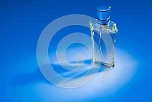 Perfume bottle on blue background