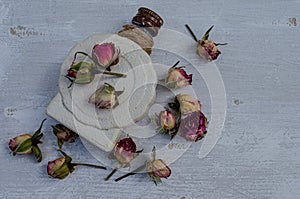 Perfume bottle, dry roses in vintage style