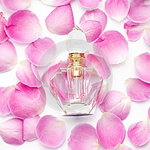 Perfume bottle with flower petals on white background. Perfumery, cosmetics, fragrance collection