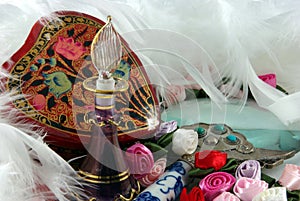 Perfume Bottle, Flowers And Feathers