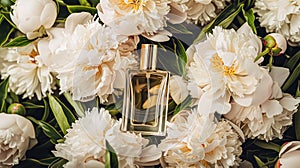 Perfume bottle in flowers, fragrance on blooming background, floral scent and cosmetic product