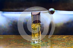 Perfume bottle on the golden and black background